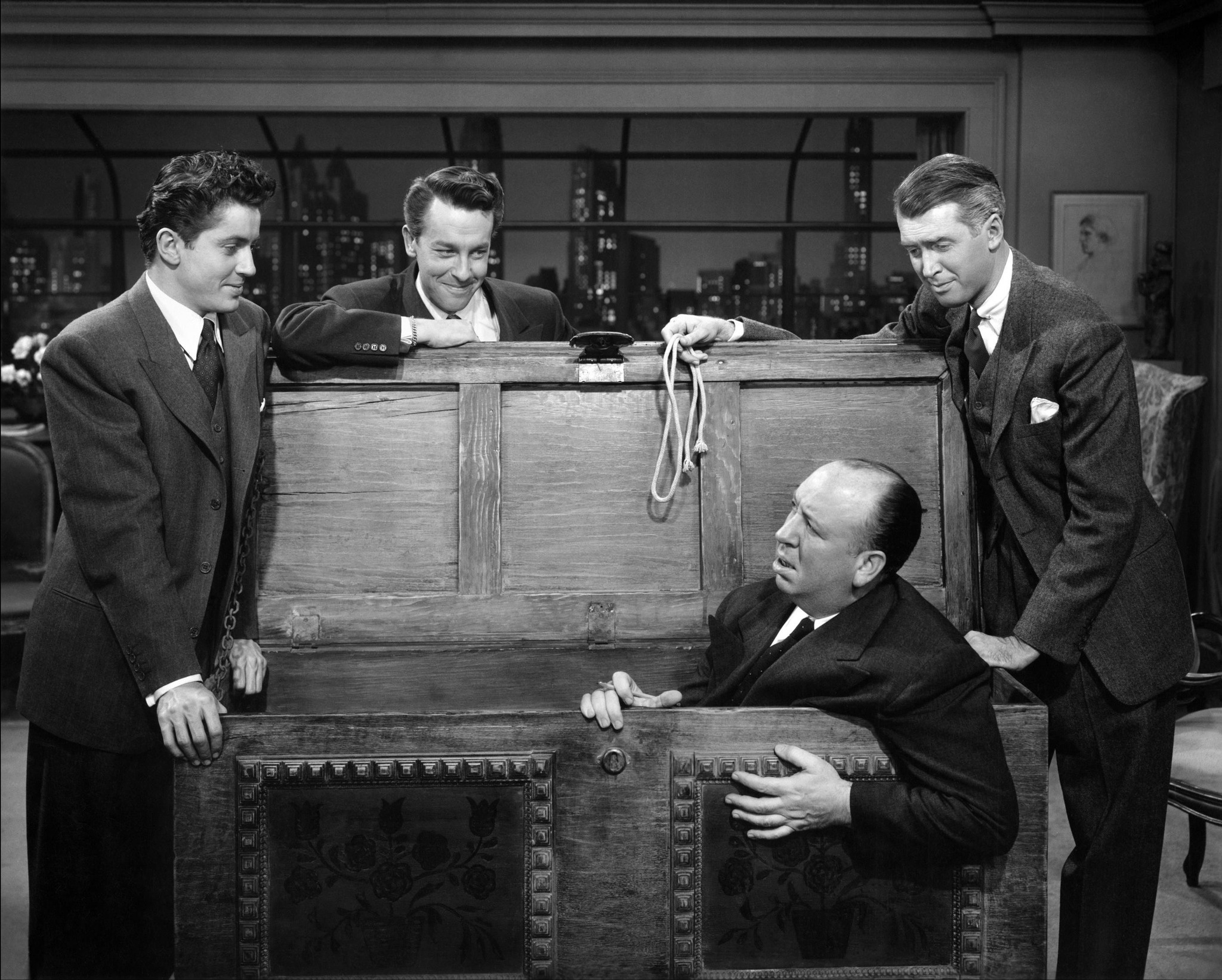 Farley Granger, John Dall, James Stewart and Alfred Hitchcock on the set of Rope (1948)
